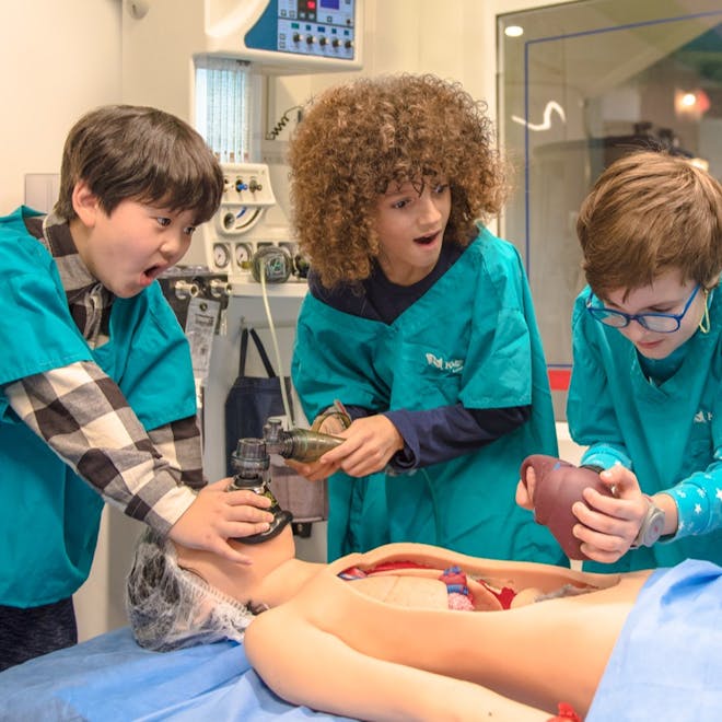 Boys enjoy playing at being surgeons at KidZania London