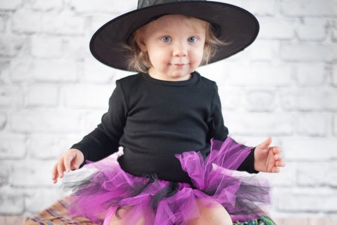 little girl in witch costume