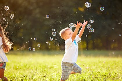 Kids playing with bubbles
