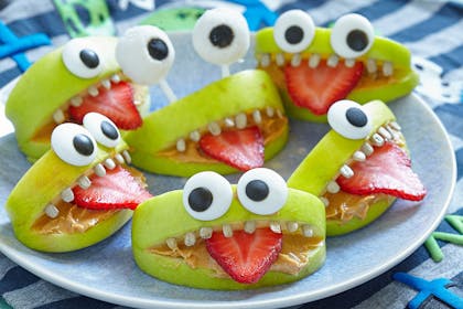 apple slice snacks that look like monsters with eyes and a tongue