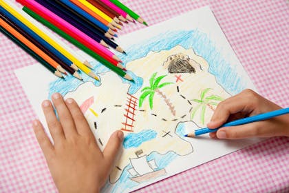 Child drawing a treasure map