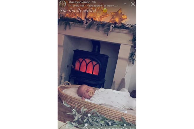 Stacey Solomon's daughter by the fireplace
