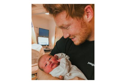Greg Rutherford holding baby