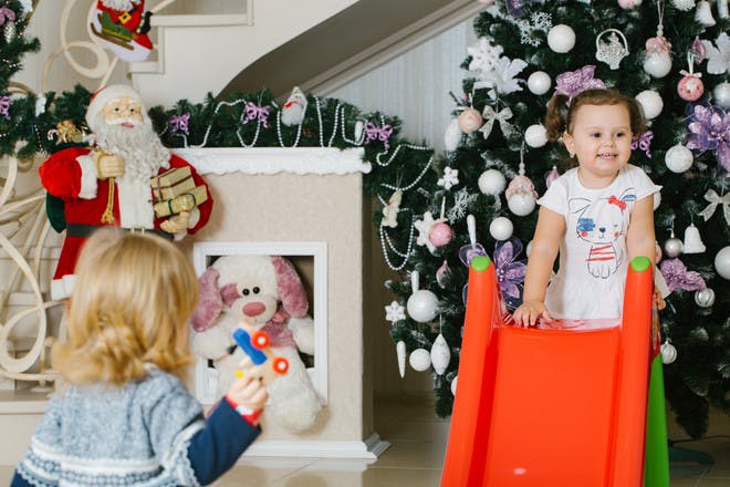 Children playing with christmas presents