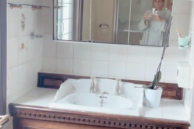 Stacey Solomon poses in her bathroom before decorating it 