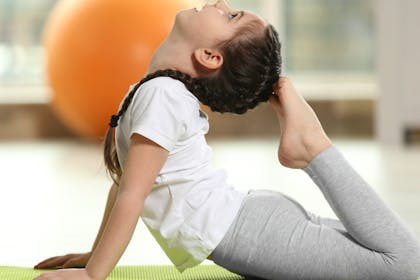 Child doing yoga