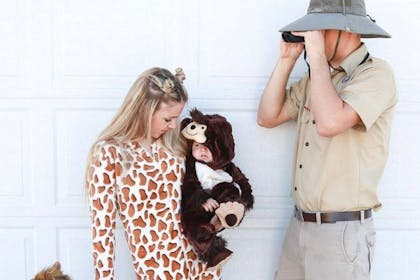 Family dressed as zoo animals and zoo keeper