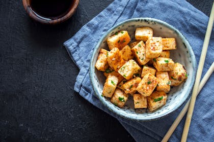 Bowl of tofu with chopsticks