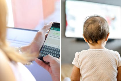 Phone in hand and toddler in front of TV
