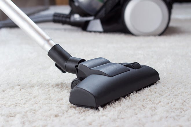 vacuum on white carpet