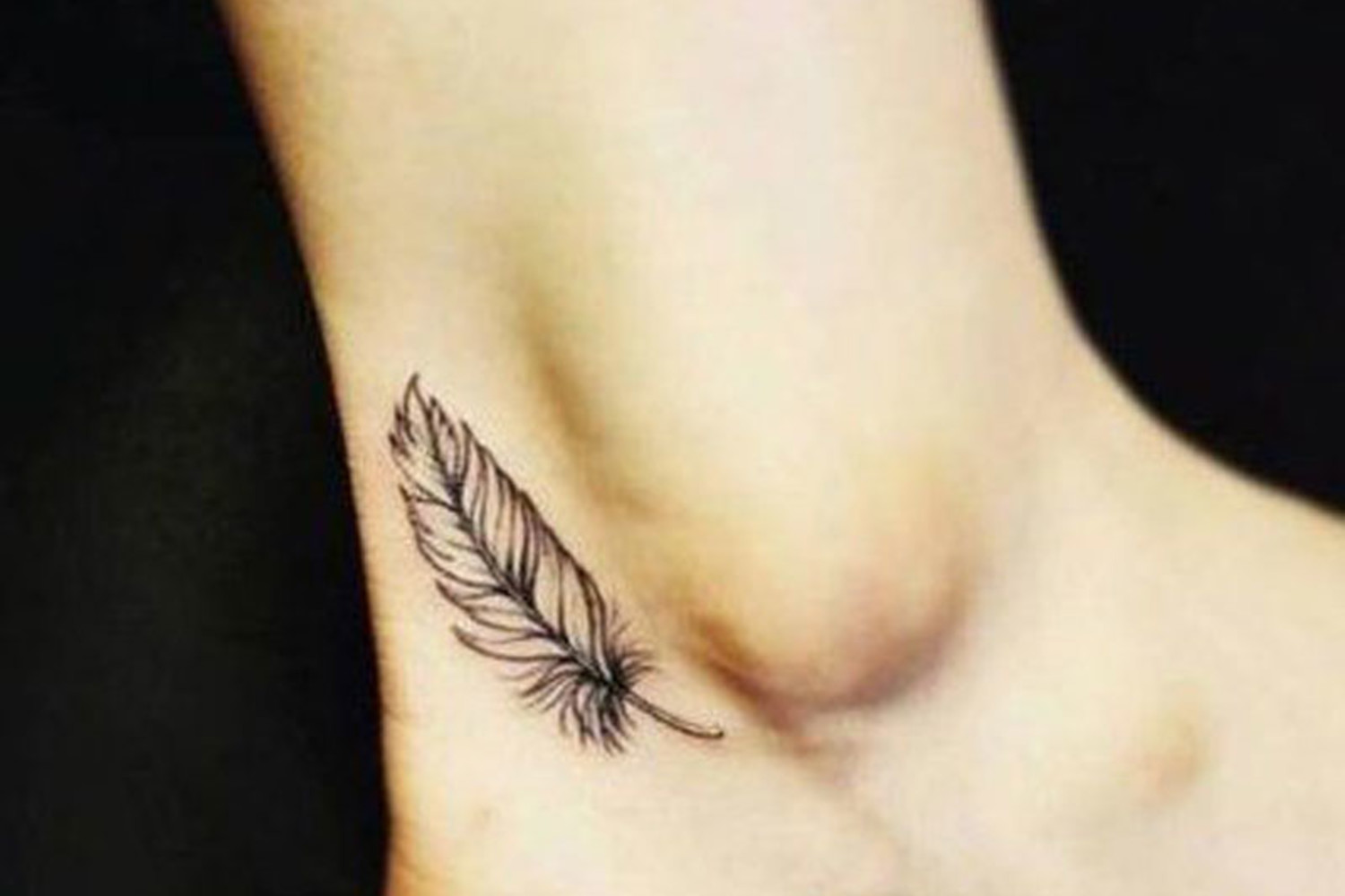 26 Awesome Feather Ankle Tattoos