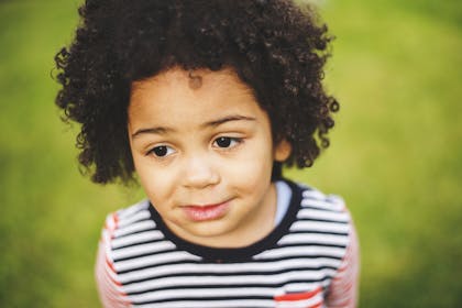 little girl wearing striped t-shirt