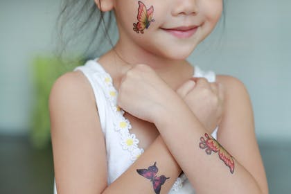 Little girl with temporary tattoos