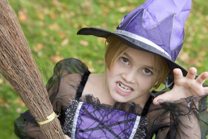 Little girl dressed as witch