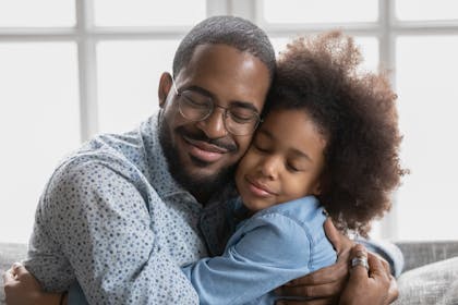 Dad hugging child