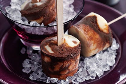 Frozen chocolate and vanilla ice cream on lolly sticks