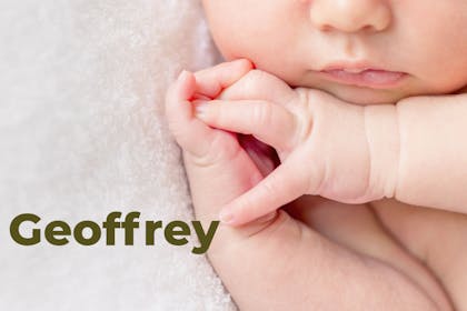 Sleeping baby's cheeks, mouth and hands. Name Geoffrey written in text