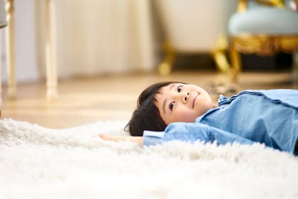 Boy lying on floor