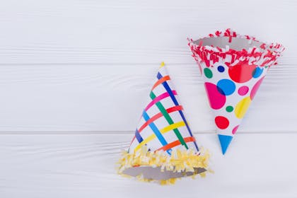 Paper cone party hats decorated with funky patterns