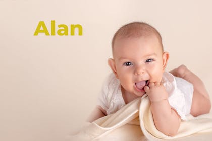 Baby pulling funny face holding blanket. Name Alan written in text