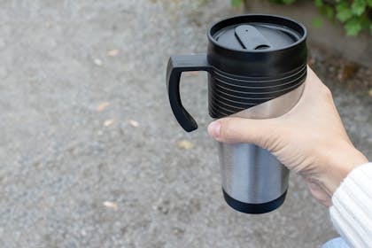 Holding drink thermos