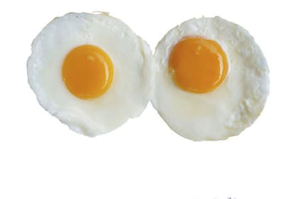 two fried eggs on white background