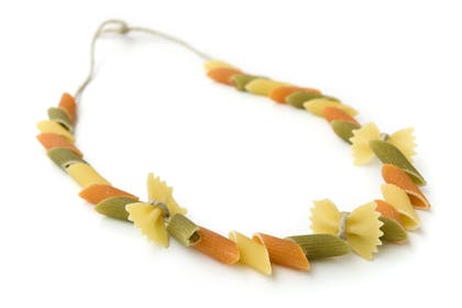 pasta shapes threaded on string to make necklace