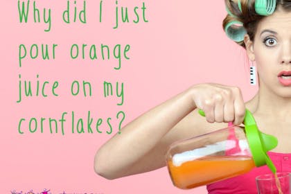 woman with rollers pouring orange juice looking frazzled