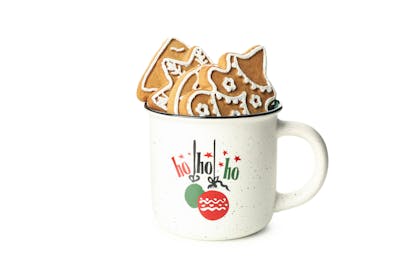Christmas mug that says 'ho ho ho' and is filled with Christmas biscuits