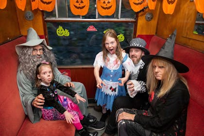 A family in fancy dress enjoy Halloween fun on the East Lancashire Railway