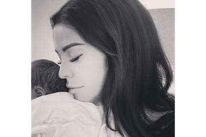 Jessica Wright cuddles newborn