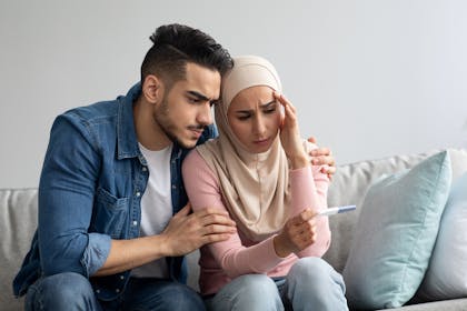 Couple looking at a pregnancy test