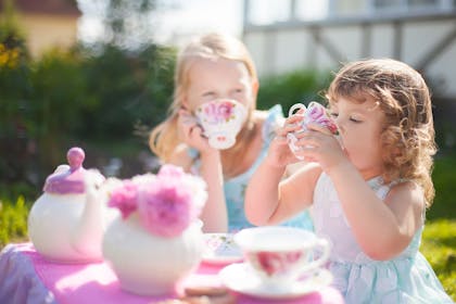 Two little girls having tea party
