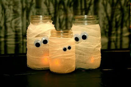 Glass jars turned into Halloween mummies