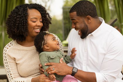 Mum and dad interacting with baby