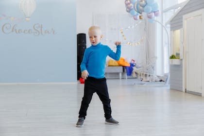 Kid dancing at Frozen themed party