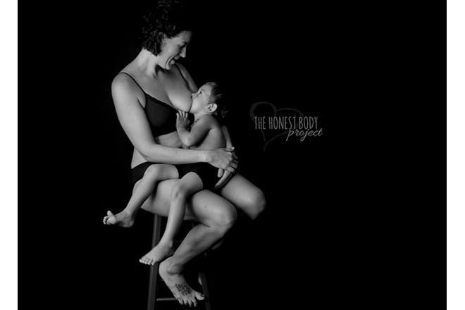 mother breastfeeding older child