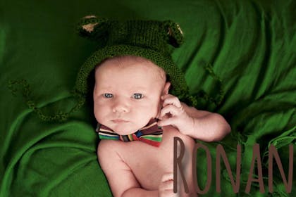baby on green fabric with Irish name Ronan