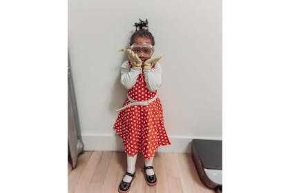 Girl dressed in Ada Twist, Scientist costume for World Book Day
