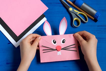 Pink envelope decorated to look like Easter bunny face