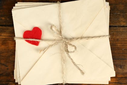 letters tied up in string with a love heart