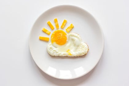 Fried egg that looks like a cloud with the yolk as a sun