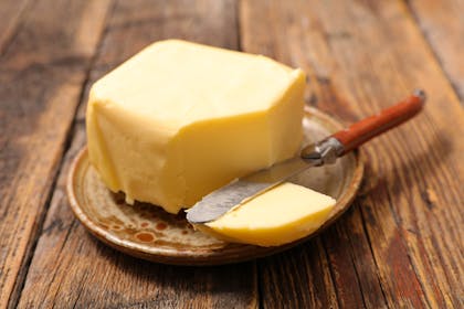 Block of butter with butter knife
