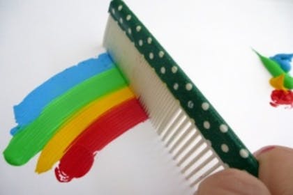 painting rainbow with comb 