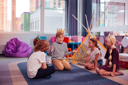 Group of kids playing a game of charades 