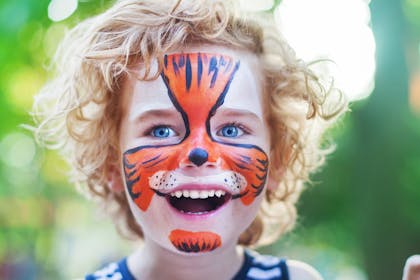 child with tiger face paint