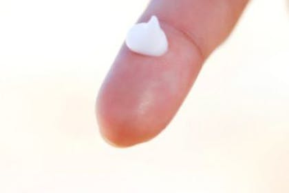 dot of cream on finger