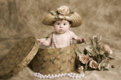 baby in hatbox