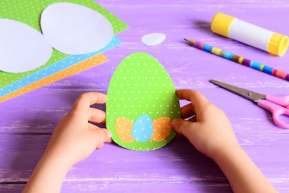 Easter egg shaped card with more paper eggs glued to front