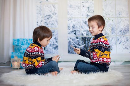 Kids playing cards at Christmas